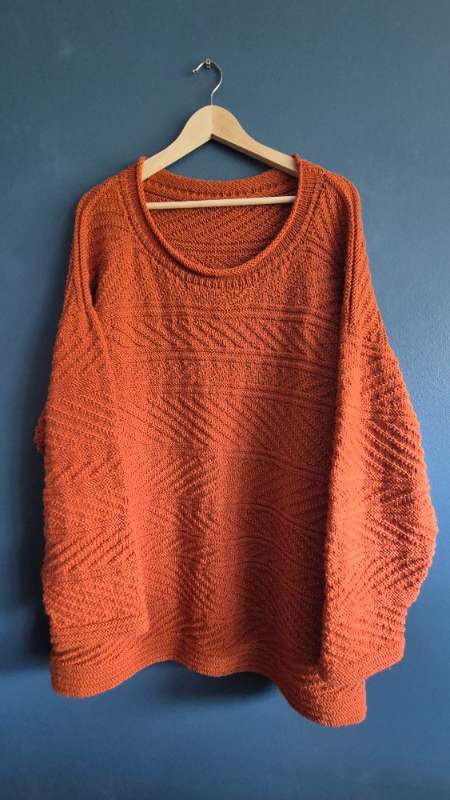 Orange hand-knitred sweater